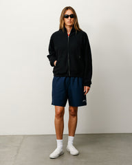 Sport Short unisex shorts in navy performance fabric with Stüssy logo at left leg