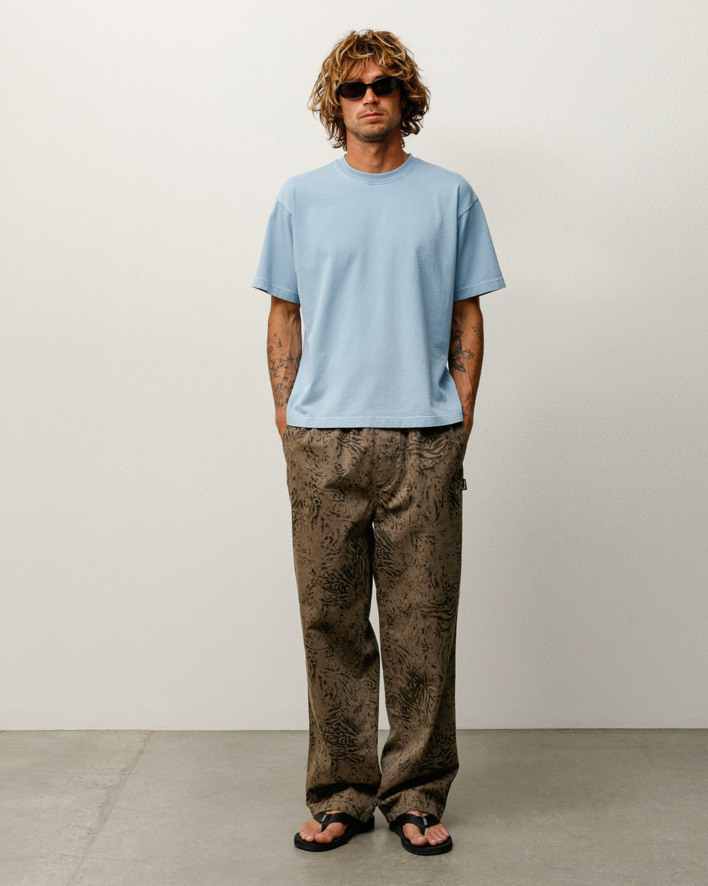 Stüssy Garment Dyed SS Tee, relaxed short-sleeve midweight cotton in the color Dust Blue