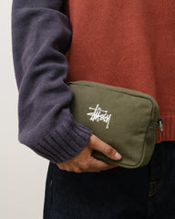 CANVAS POUCH Accessories in the color Green, compact canvas zip pouch with white Stüssy logo embroidery.
