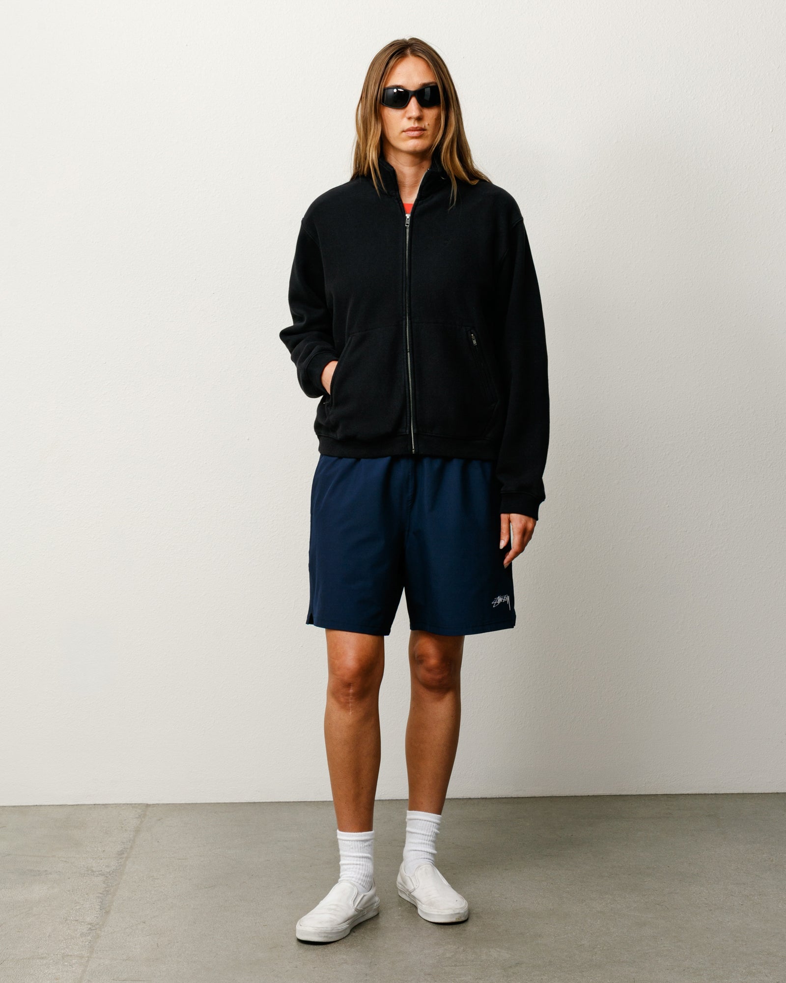 Sport Short unisex shorts in navy performance fabric with Stüssy logo at left leg