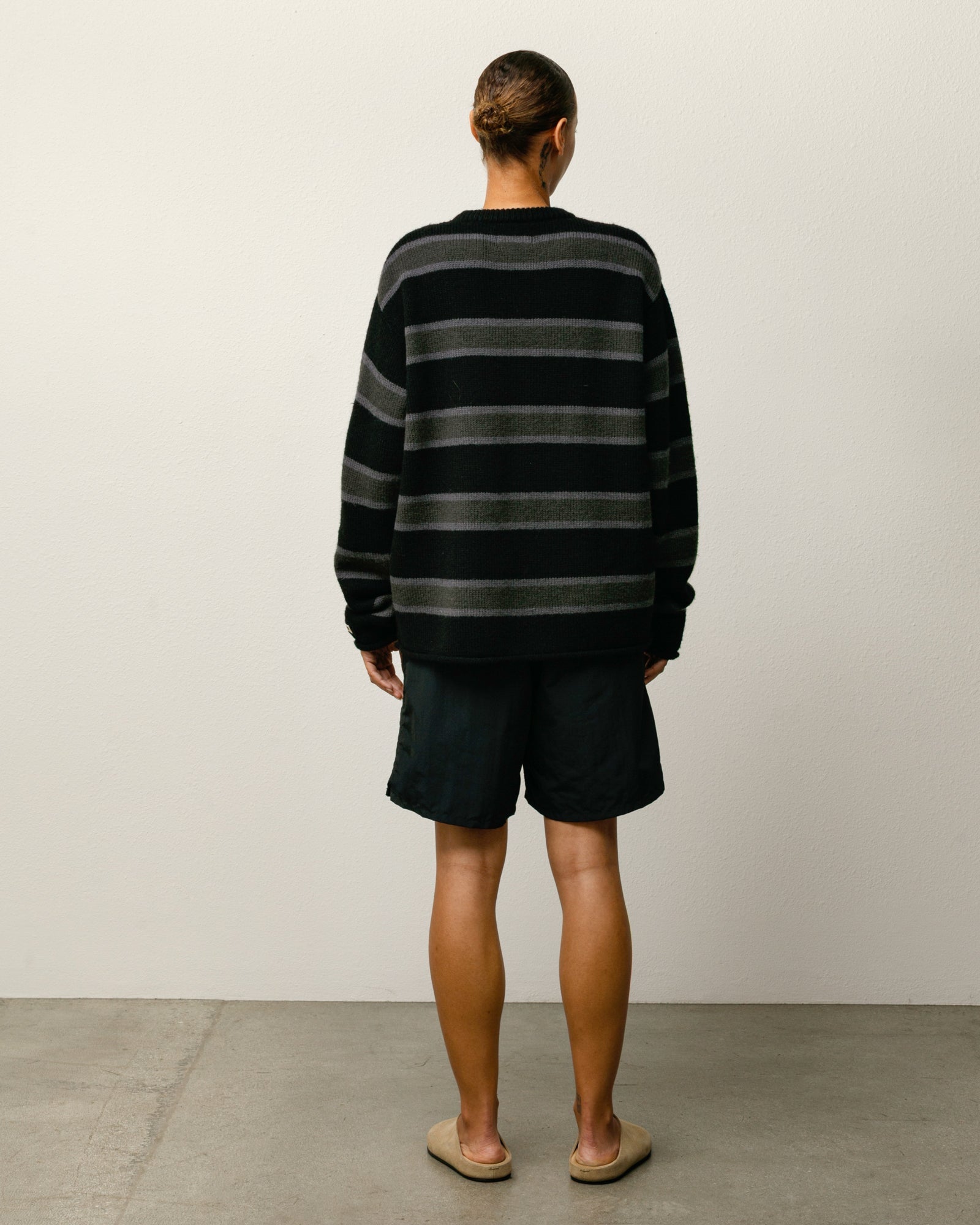 Stock Water Short shorts in black nylon with elastic waist and Stüssy logo at left leg