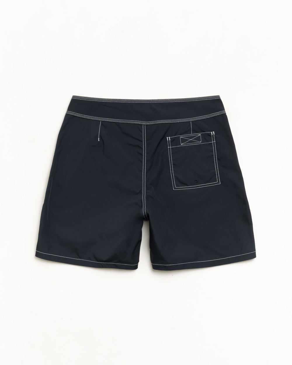 Coastal Board Short in Black, back flat with contrast stitching and a rear patch pocket