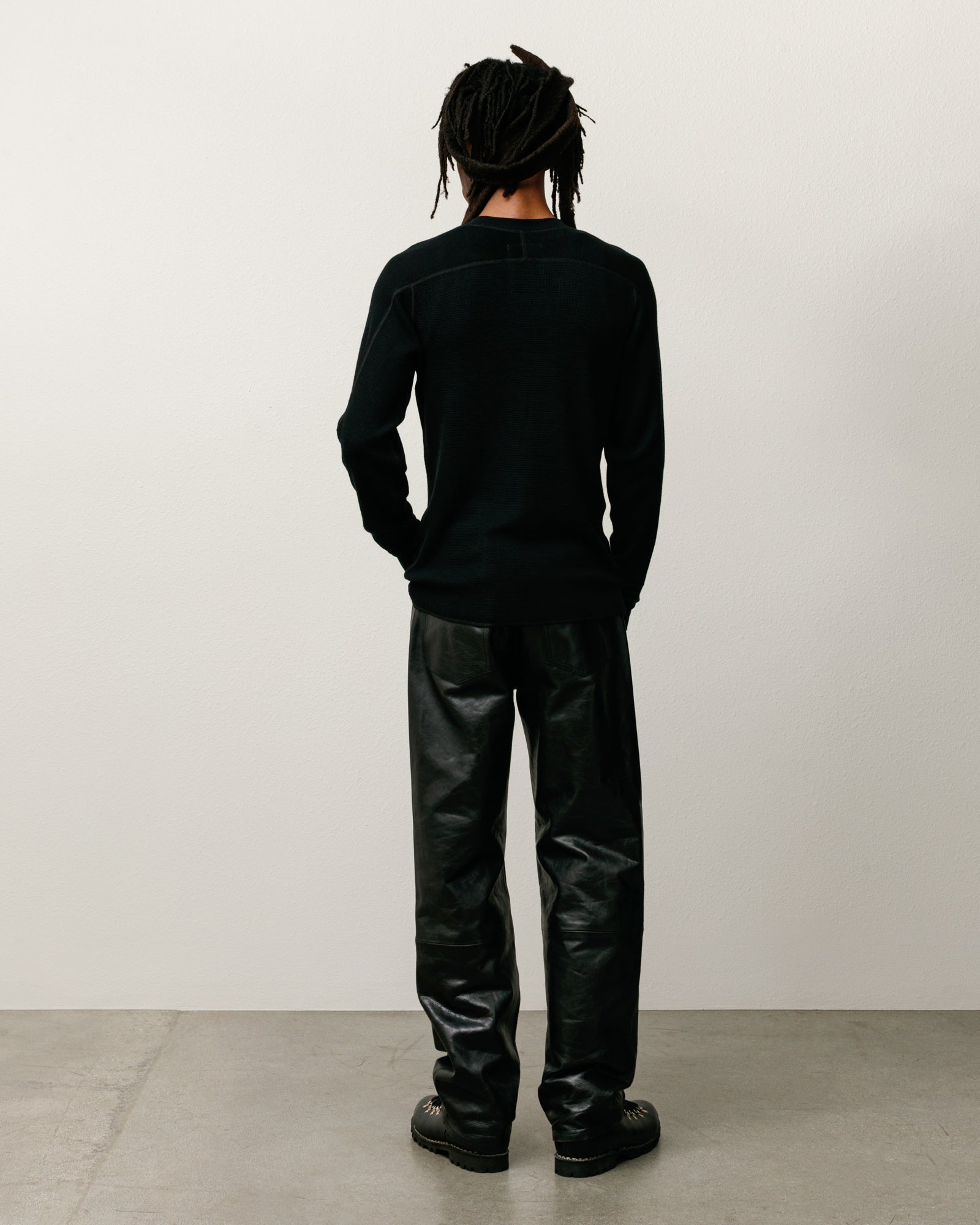 Wool LS Thermal knit in black, waffle-knit wool long sleeve shown from the back on model by Stüssy