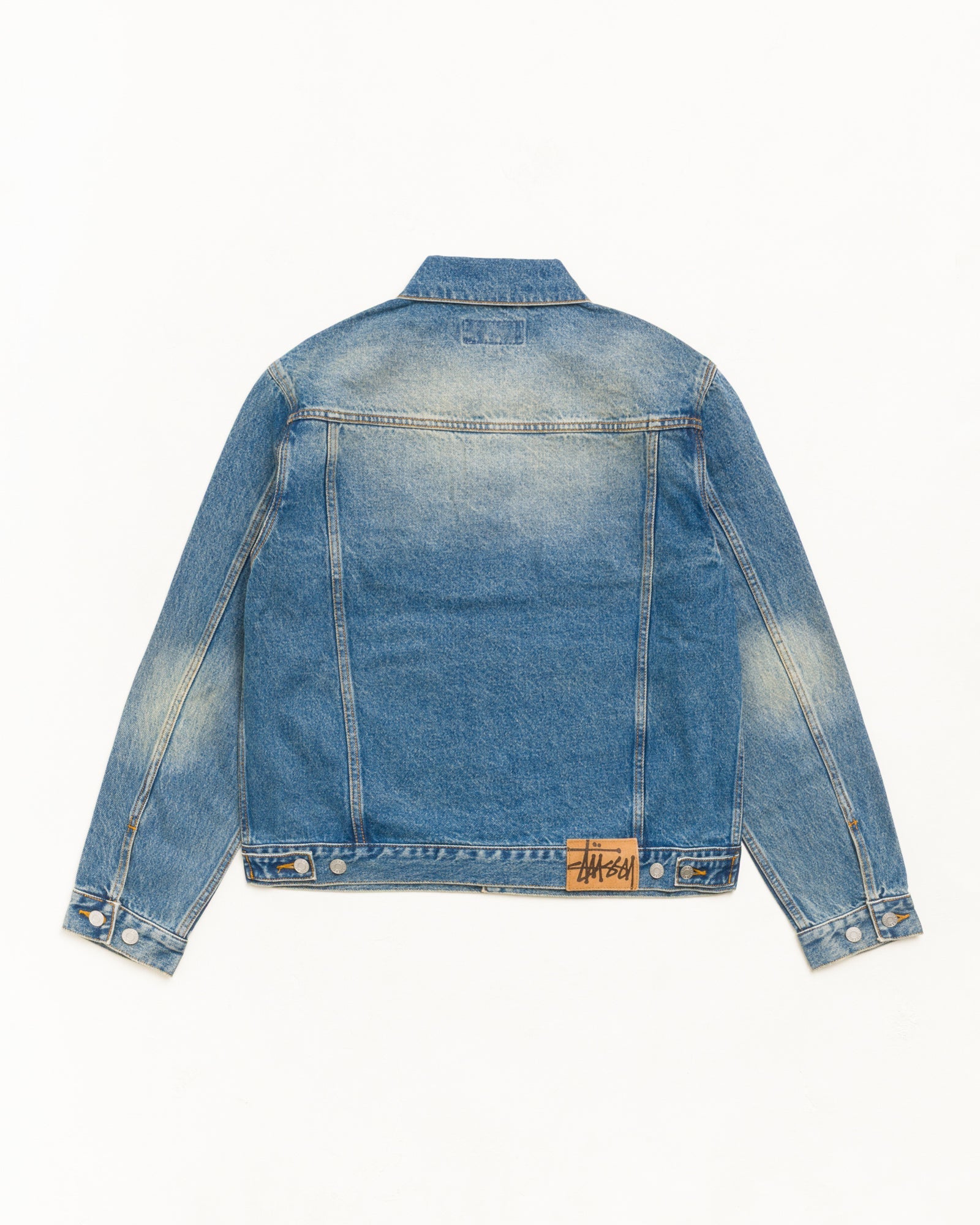 Denim Trucker Jacket in Dark Wash Indigo with suede Stüssy logo patch at back