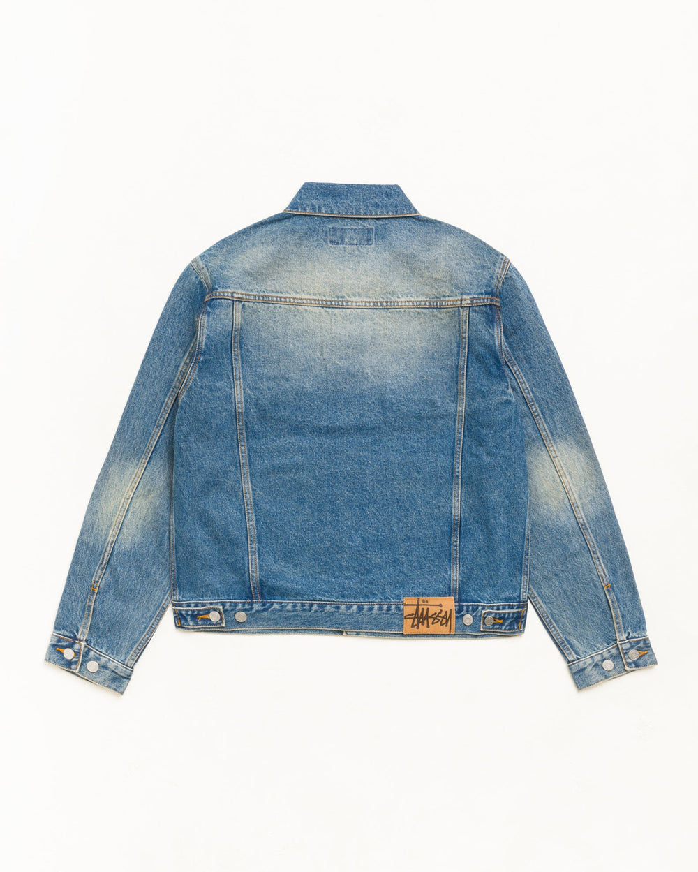 Denim Trucker Jacket in Dark Wash Indigo with suede Stüssy logo patch at back