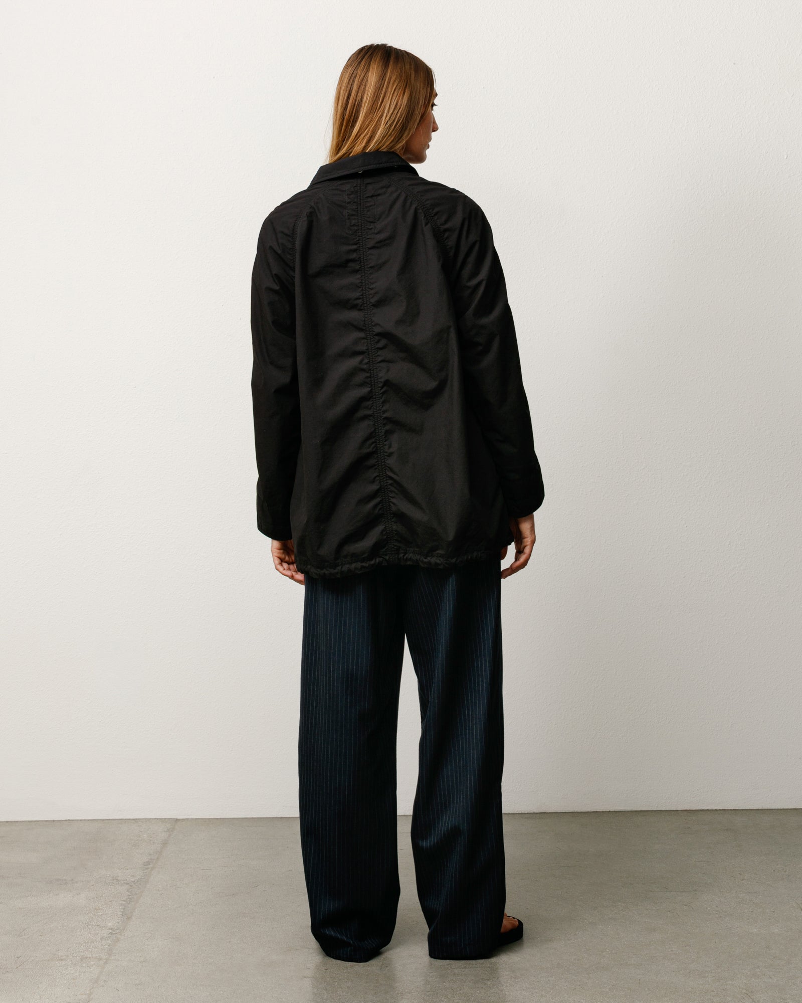 Lightweight long coat, unisex long-sleeve in black by Stüssy