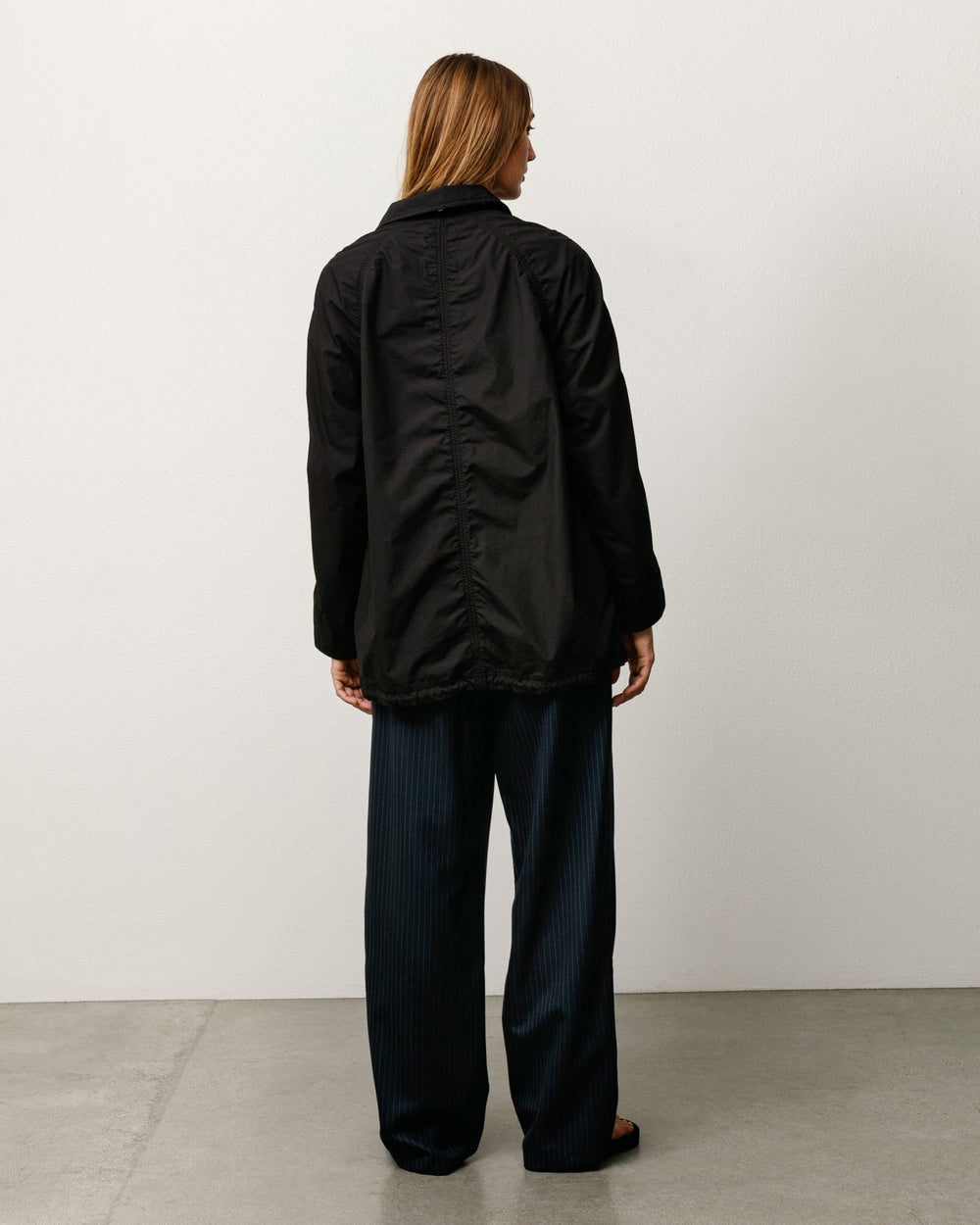 Lightweight long coat, unisex long-sleeve in black by Stüssy