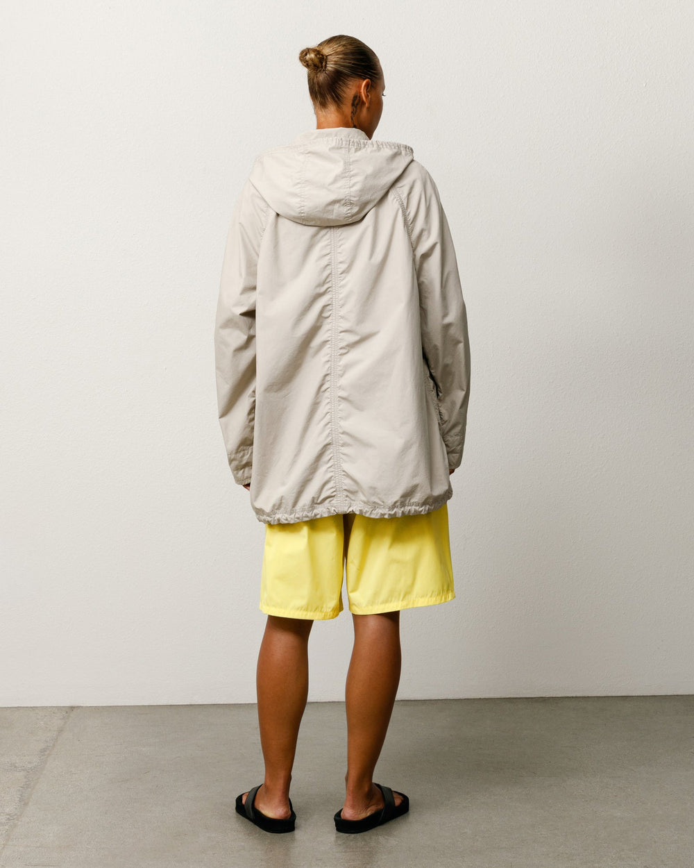 Lightweight Field Parka Parka in Stone, relaxed fit washed cotton with a removable hood for versatile wear.