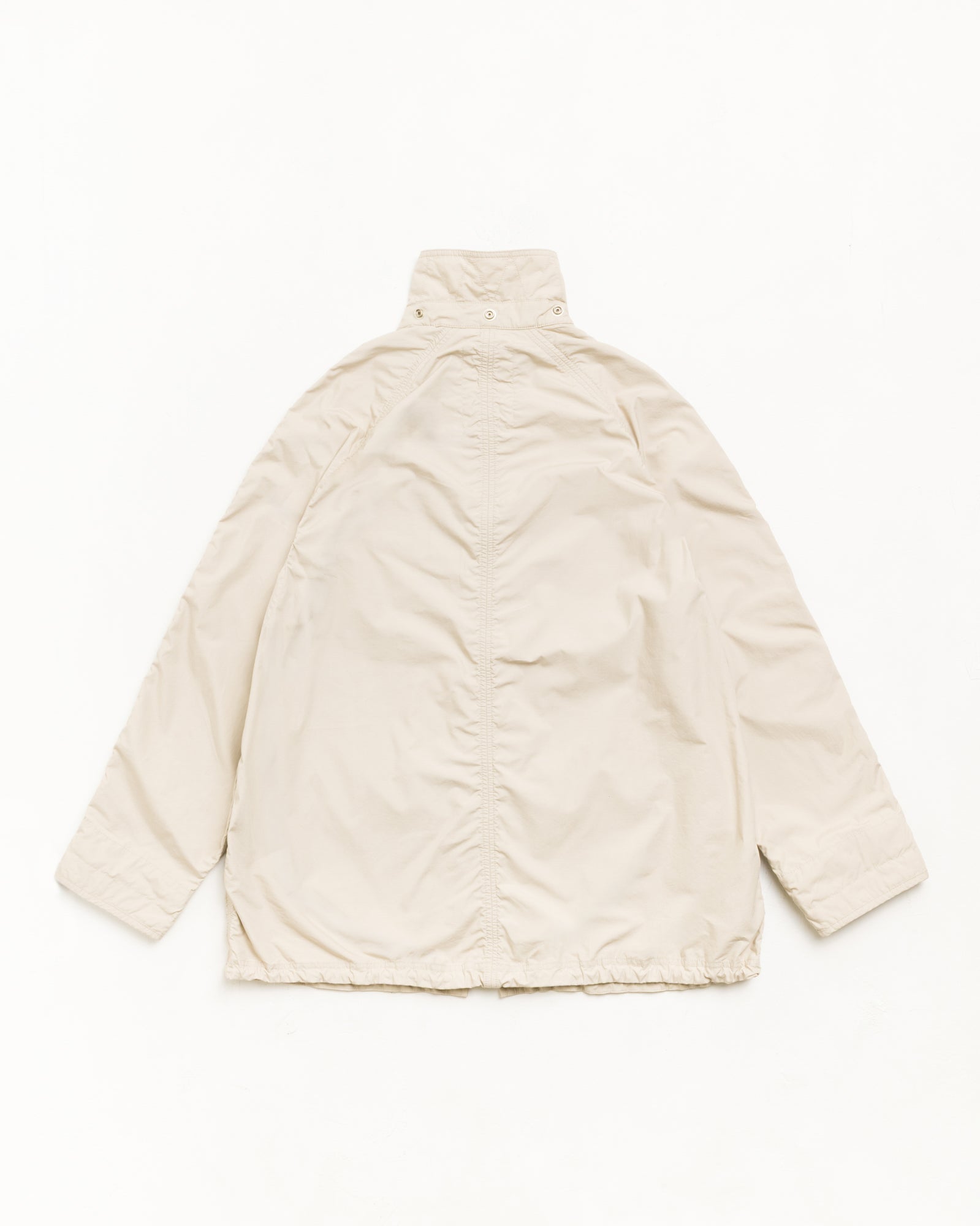 Lightweight long coat parka in stone, unisex long sleeves, back view with stand collar in washed cotton.