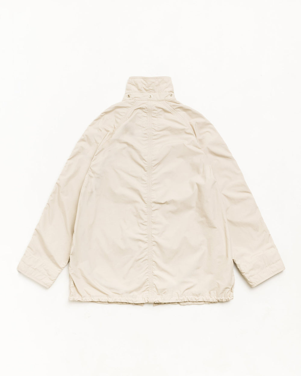 Lightweight long coat parka in stone, unisex long sleeves, back view with stand collar in washed cotton.