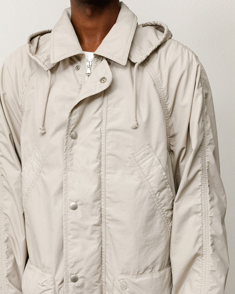 Stüssy Lightweight Field Parka in Stone, double-layered washed cotton with snap placket and hood.