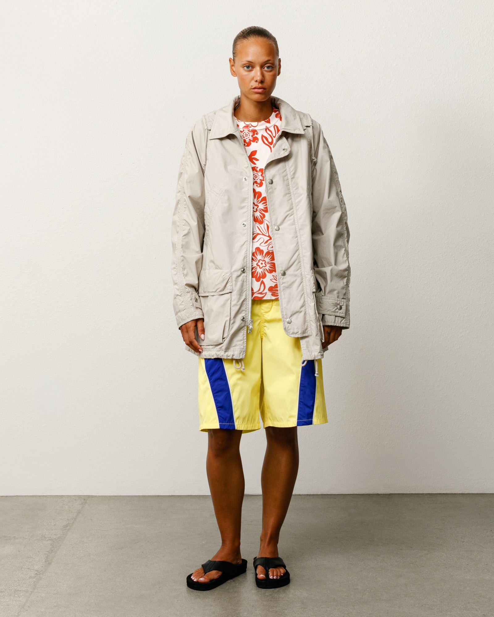 Lightweight unisex long coat with long sleeves in Stone.