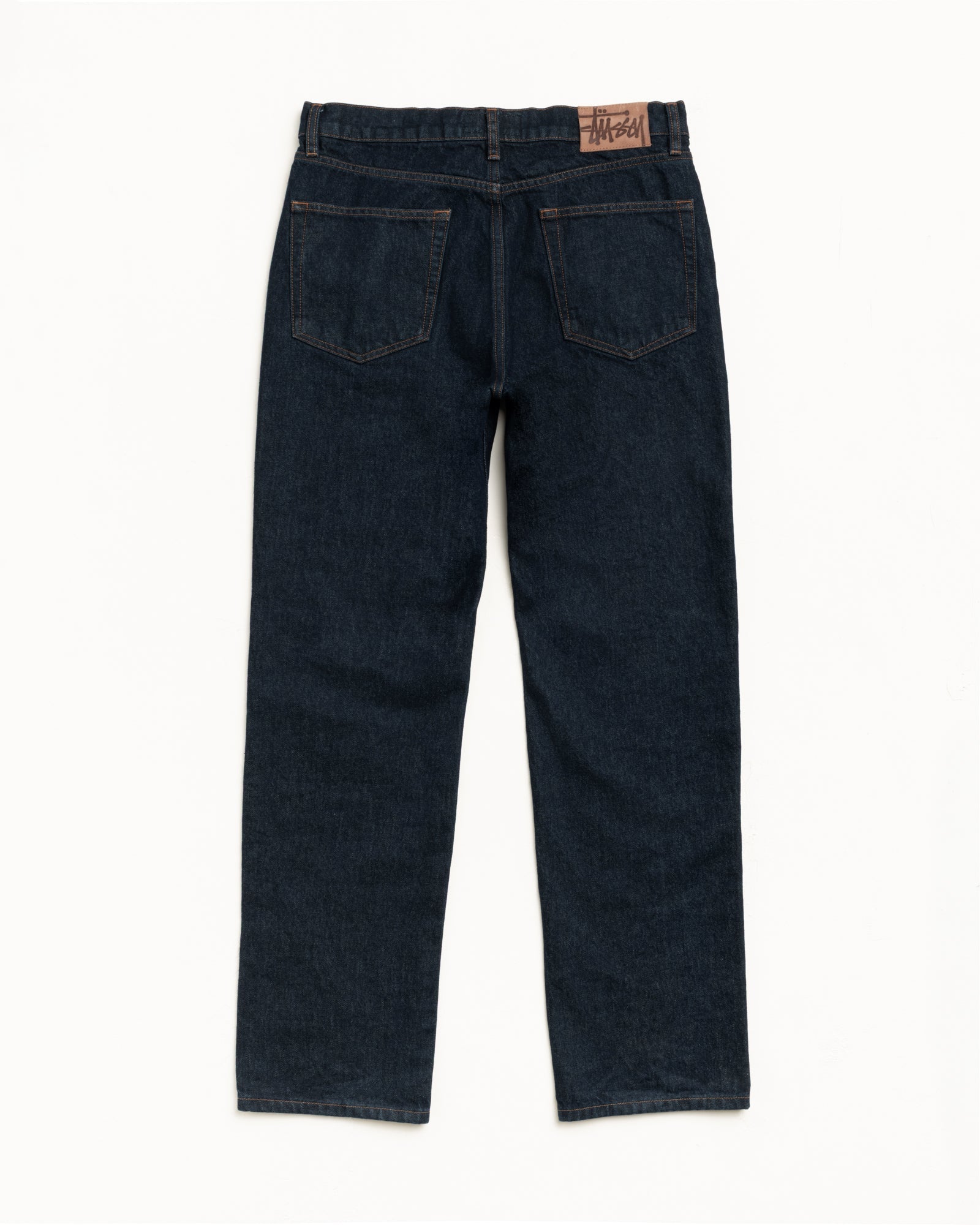 SLIM JEAN DENIM pants in Rinsed Indigo, straight cut with suede Stüssy patch