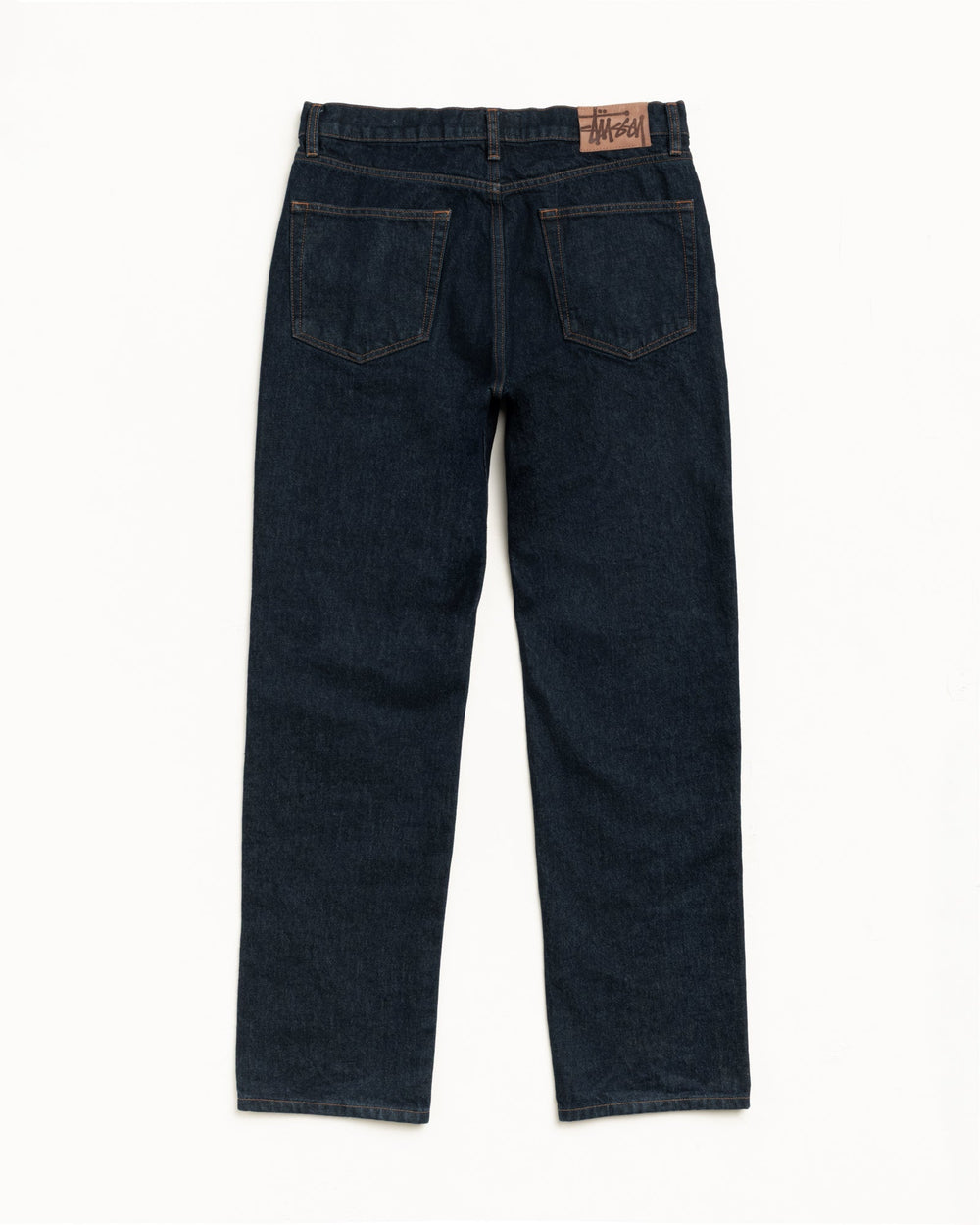 SLIM JEAN DENIM pants in Rinsed Indigo, straight cut with suede Stüssy patch
