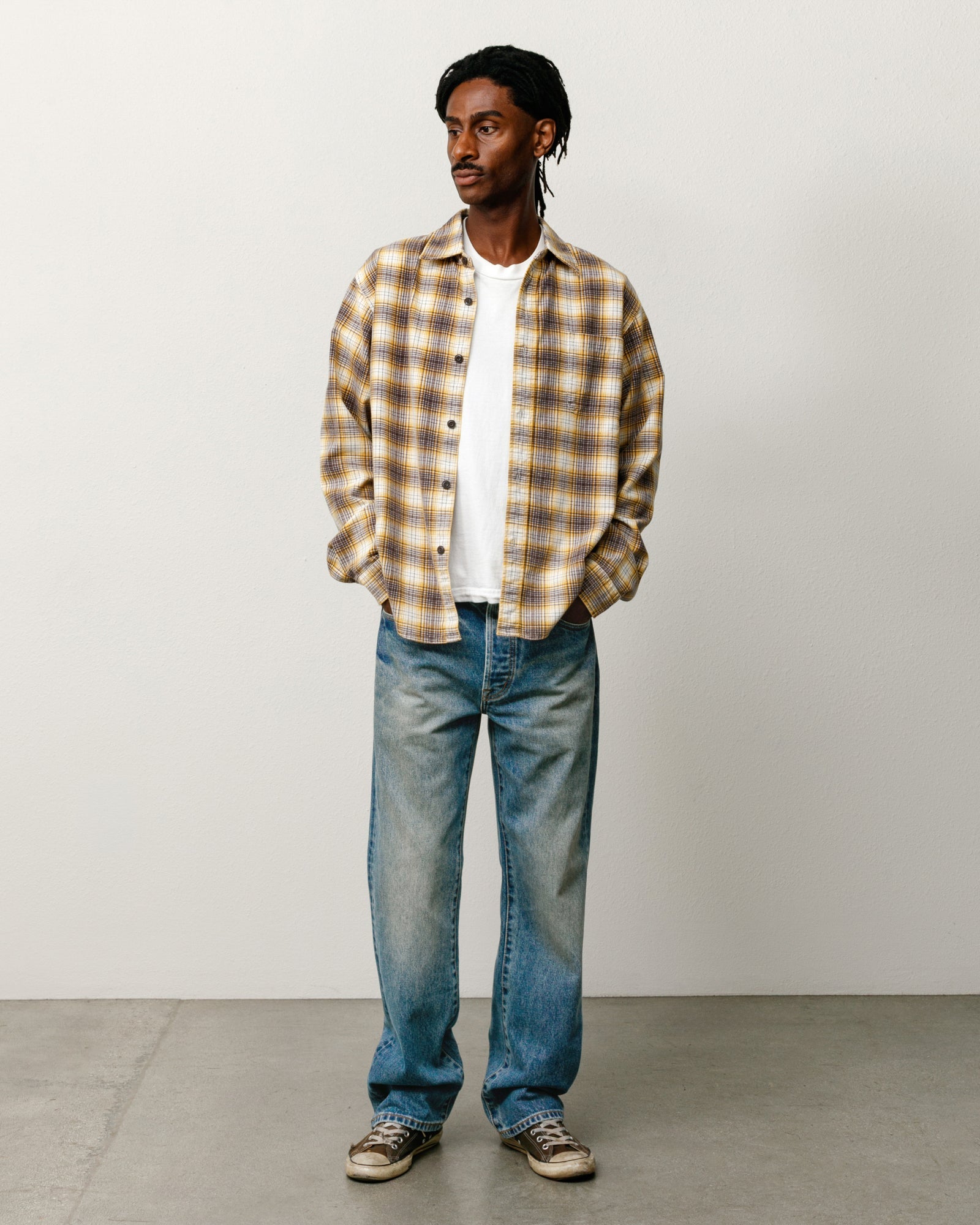 Unisex straight denim jeans in dark wash indigo, relaxed leg silhouette | product-card-slider