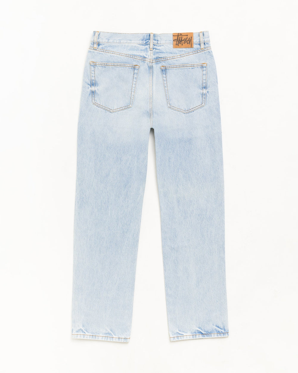 Slim Jean Denim in Light Wash Indigo with back pockets and Stüssy logo patch.