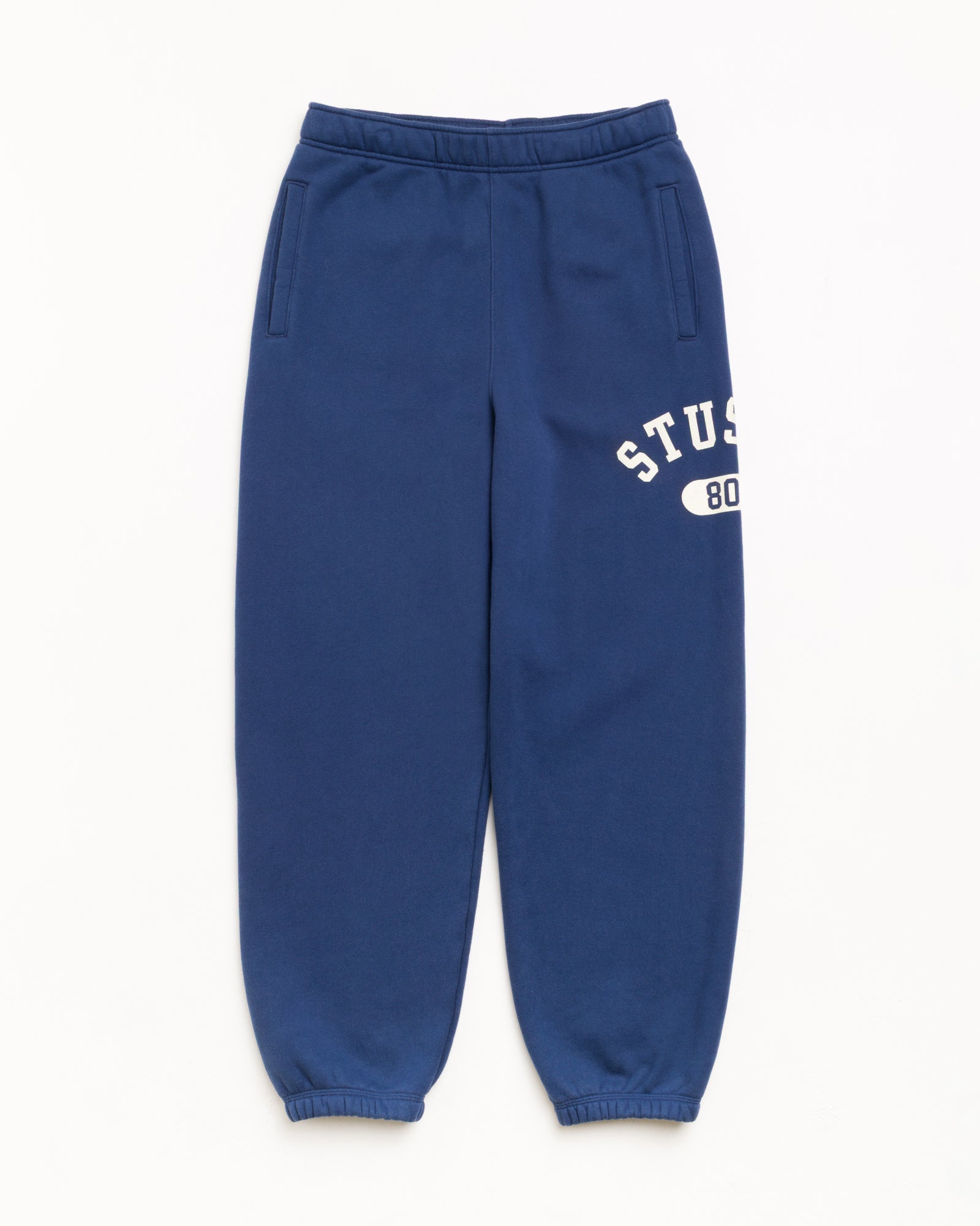 Varsity Fleece Pant Unisex Regular In Navy | hero:main:collection:new-arrivals,shirts,tops-shirts,all,tees,outerwear,denim,knits,accessories,sunglasses,hoodies,sweats,mens-hoodies-sweatshirts,shorts,pants,bottoms,crew-sweats,zip-ups,swim,sweatpants,graphics,lazy-tees,mens-swim,womens-swim,swim,basic-9twenty,button-ups,jerseys,thermals,shorts,trunks,cargos,denim-jeans,bottoms,bags,belts,wearables,gear,footwear,button-ups,basic-tops,jerseys, | product-card-slider