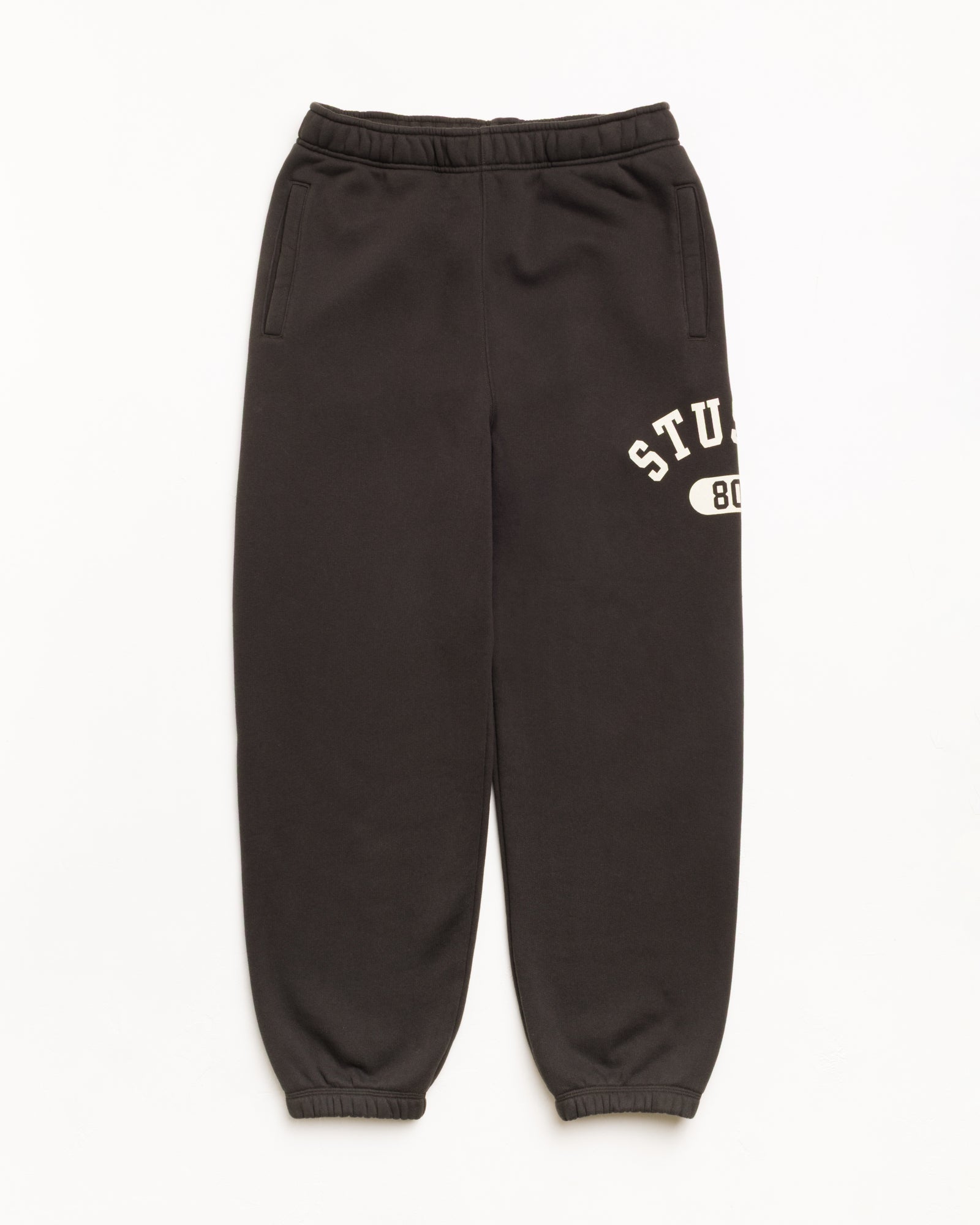Varsity Fleece Pant Unisex Regular In Washed Black | hero:main:collection:new-arrivals,shirts,tops-shirts,all,tees,outerwear,denim,knits,accessories,sunglasses,hoodies,sweats,mens-hoodies-sweatshirts,shorts,pants,bottoms,crew-sweats,zip-ups,swim,sweatpants,graphics,lazy-tees,mens-swim,womens-swim,swim,basic-9twenty,button-ups,jerseys,thermals,shorts,trunks,cargos,denim-jeans,bottoms,bags,belts,wearables,gear,footwear,button-ups,basic-tops,jerseys, | product-card-slider