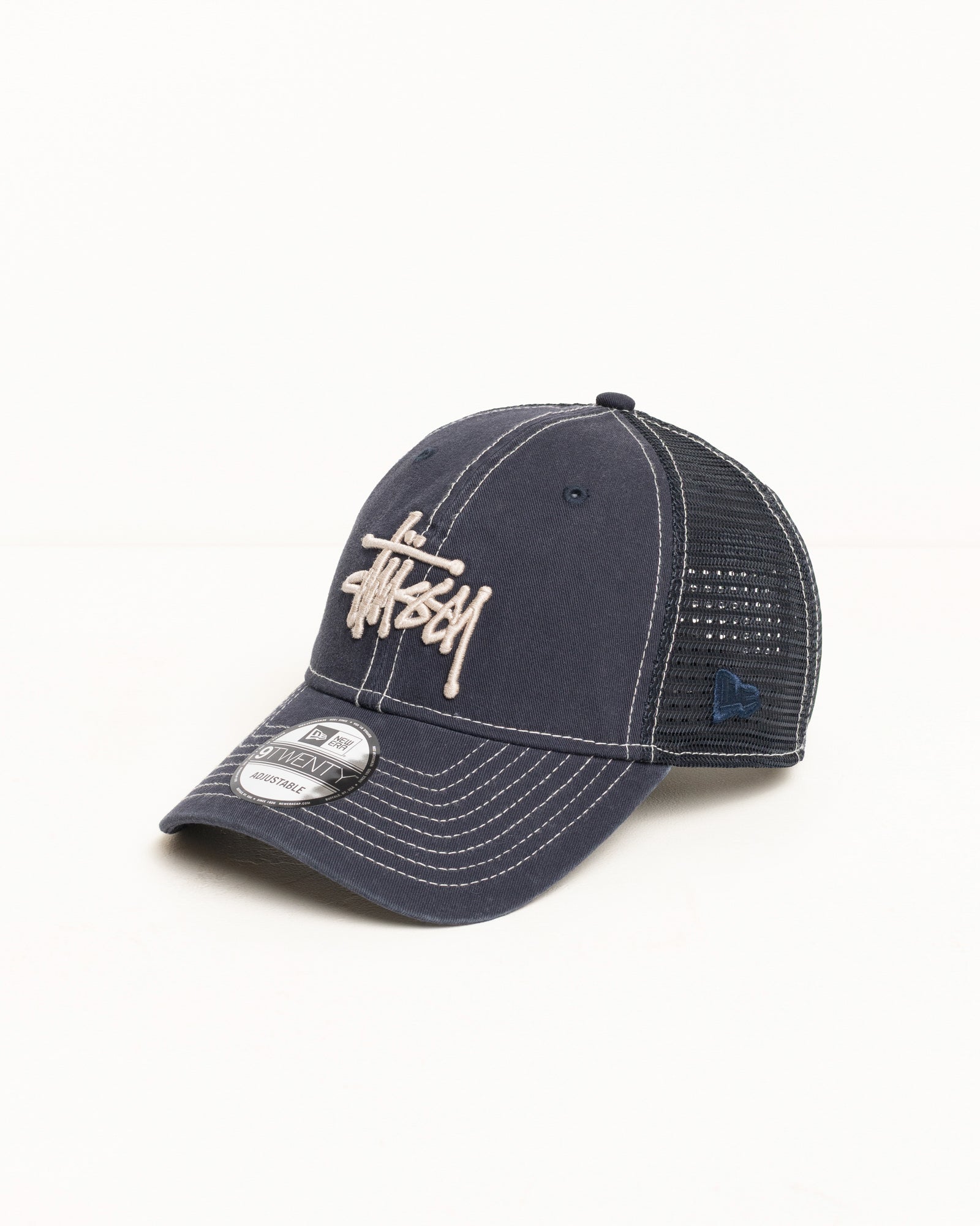 9TWENTY Washed Basic Trucker cap in navy with mesh back and Stüssy logo | product-card-slider