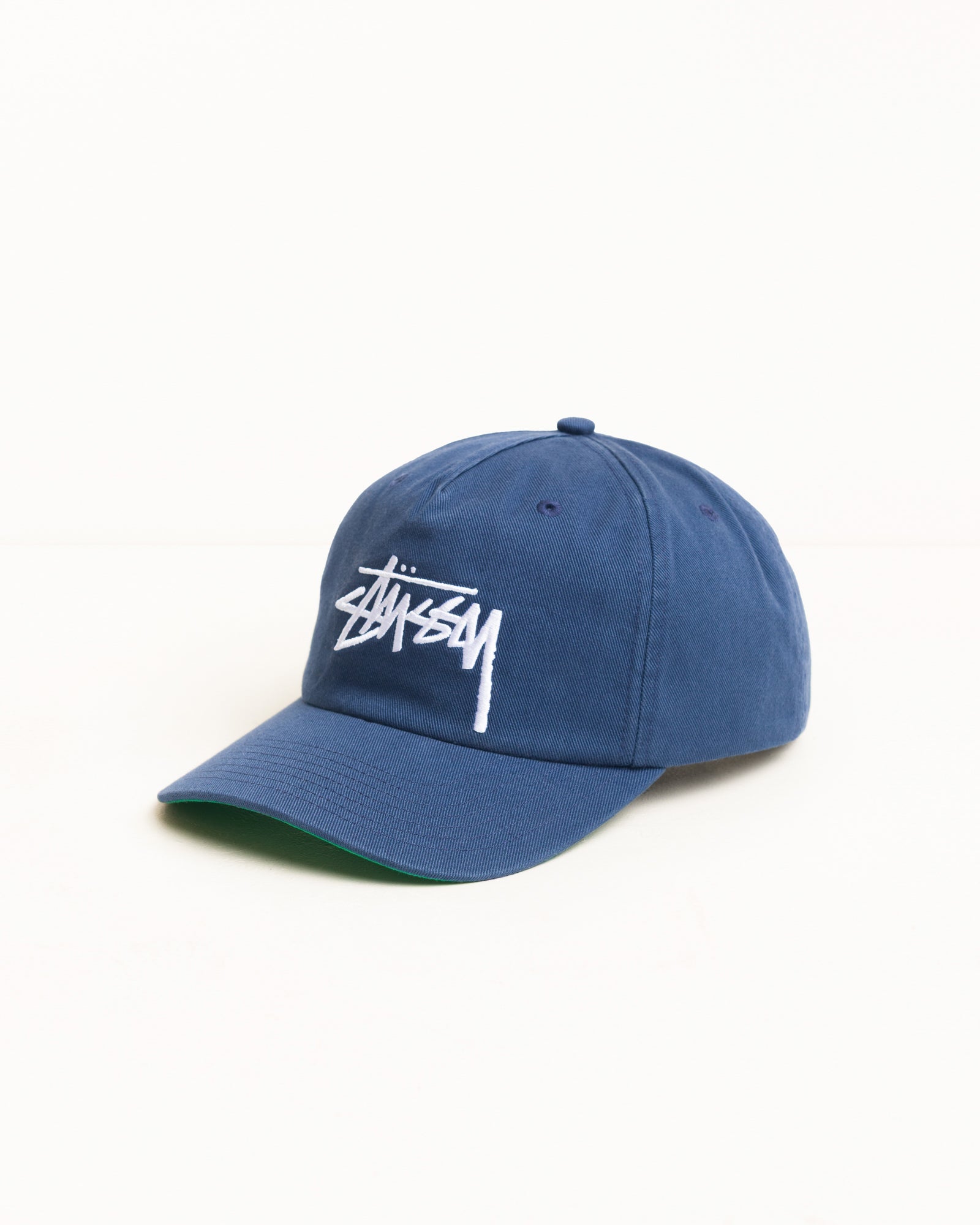 Big Stock Snapback Cap in Deep Blue, washed cotton twill with white Stüssy logo | product-card-slider
