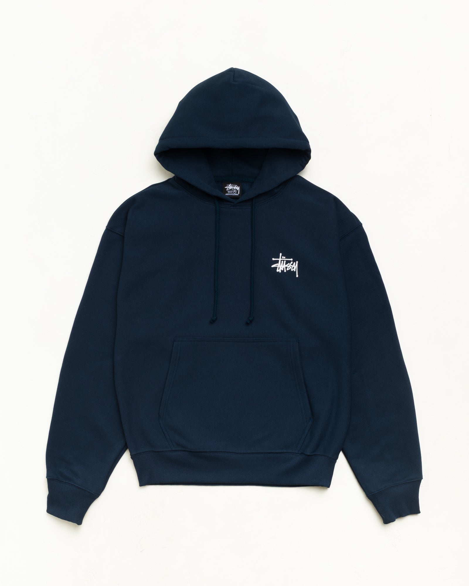 Basic Stüssy Hoodie Unisex in Navy, fleece pullover with kangaroo pocket, front flat | product-card-slider